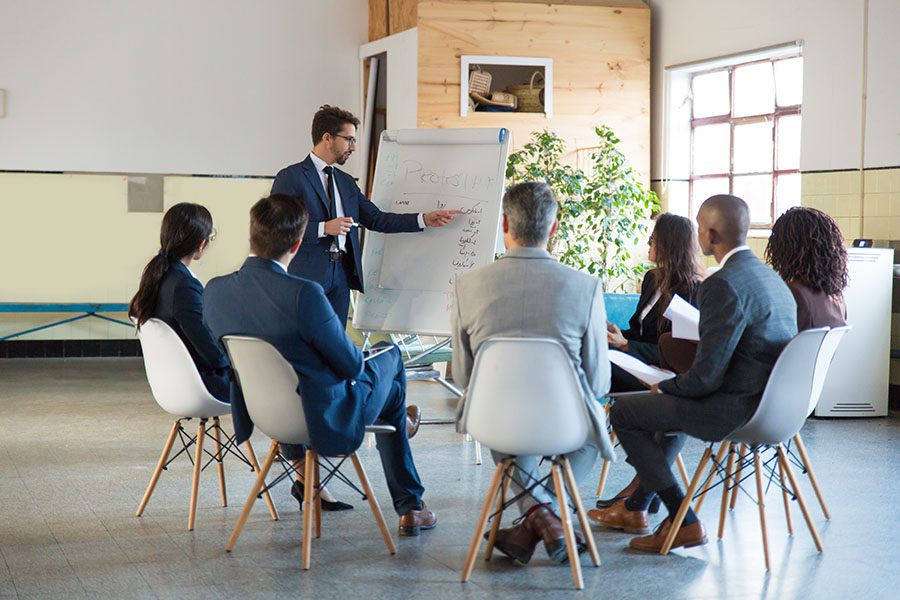 Loss Control - Group of Employees Having Meeting in the Office